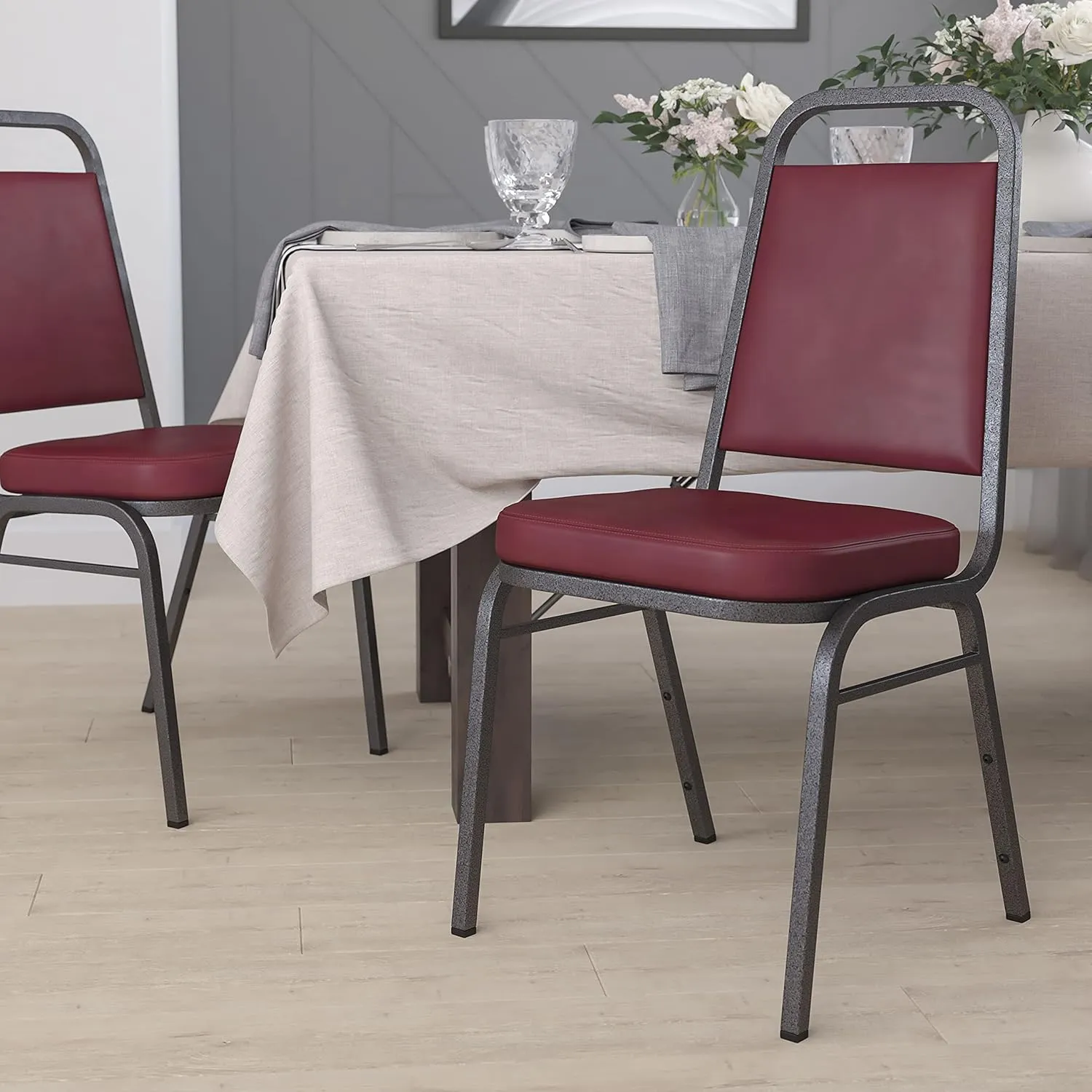 EMMA   OLIVER Trapezoid Back Banquet Chair, Burgundy Vinyl/Silver Vein Frame