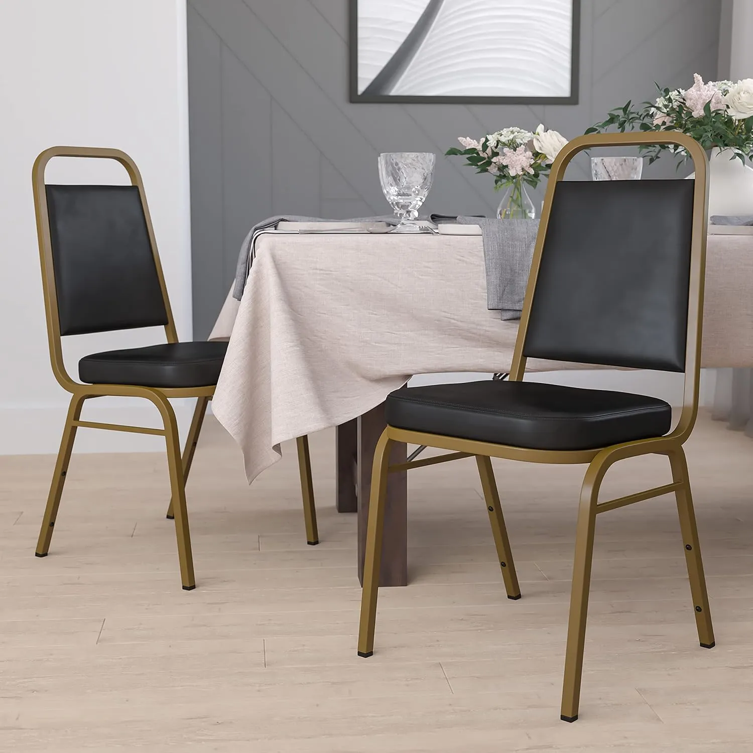 Flash Furniture 4 Pack HERCULES Series Trapezoidal Back Stacking Banquet Chair in Black Vinyl - Gold Frame