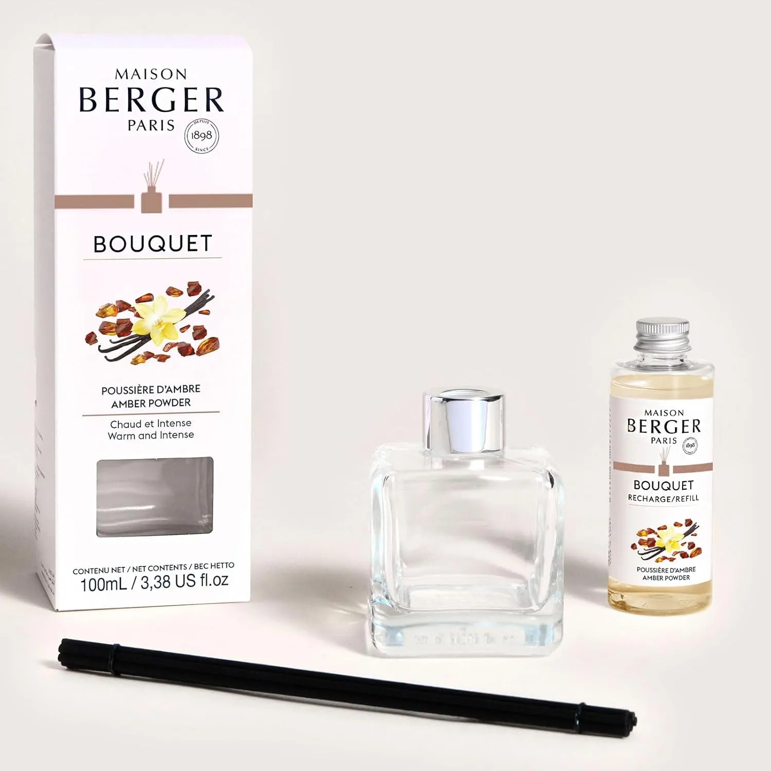 MAISON BERGER - Reed Diffuser Clear Glass Scented Bouquet - 8 Black Reed Sticks (8.3 inches) - Includes 100 Milliliters (3.4 Fluid Ounces) Fragrance Refill (Amber Powder)